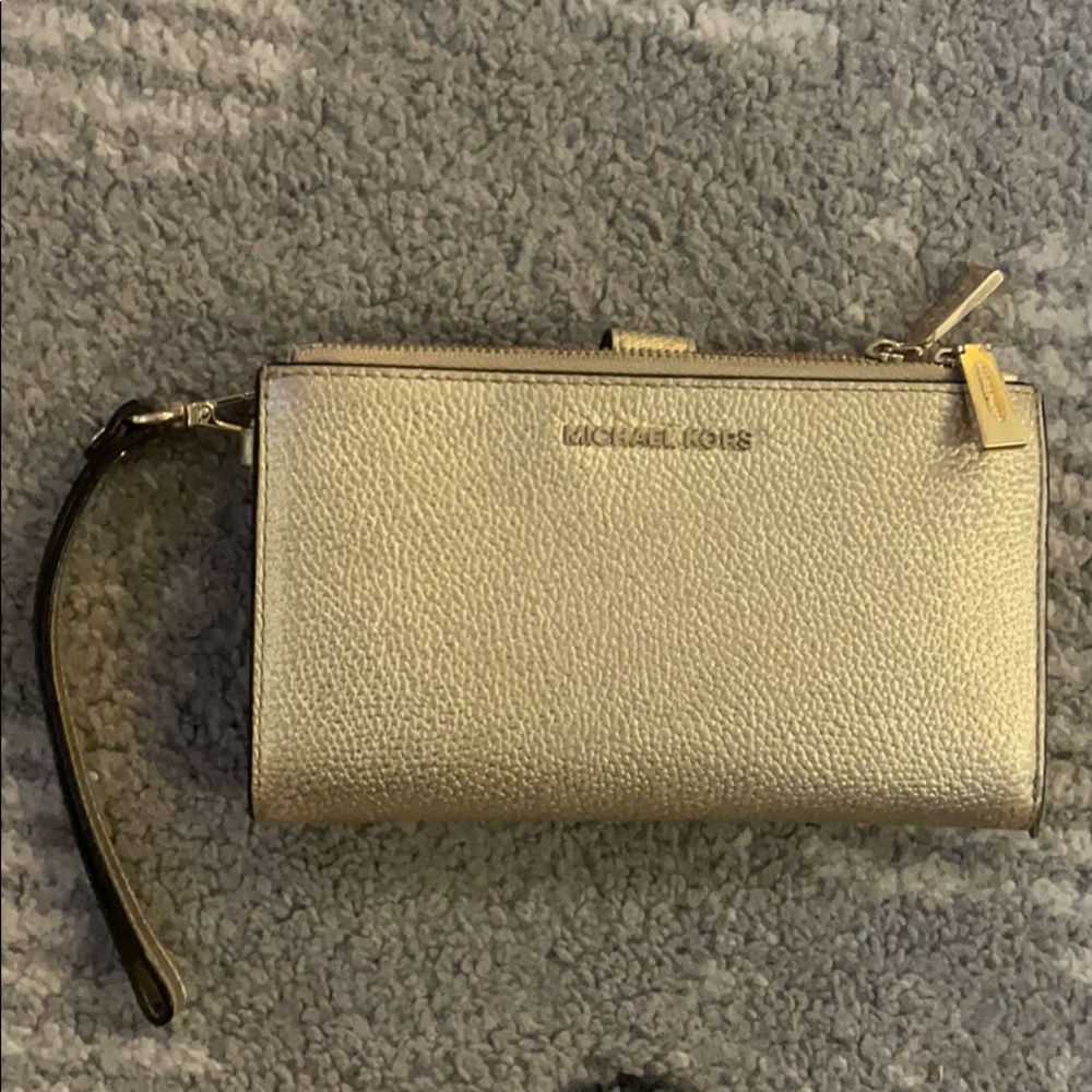 Gold Michael Kors wristlet/ wallet will also hold phone
